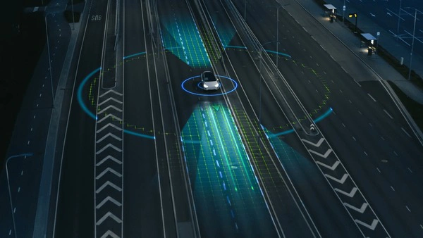 Aerial view of a self-driving car on a road, surrounded by digital navigation indicators and lane markings.